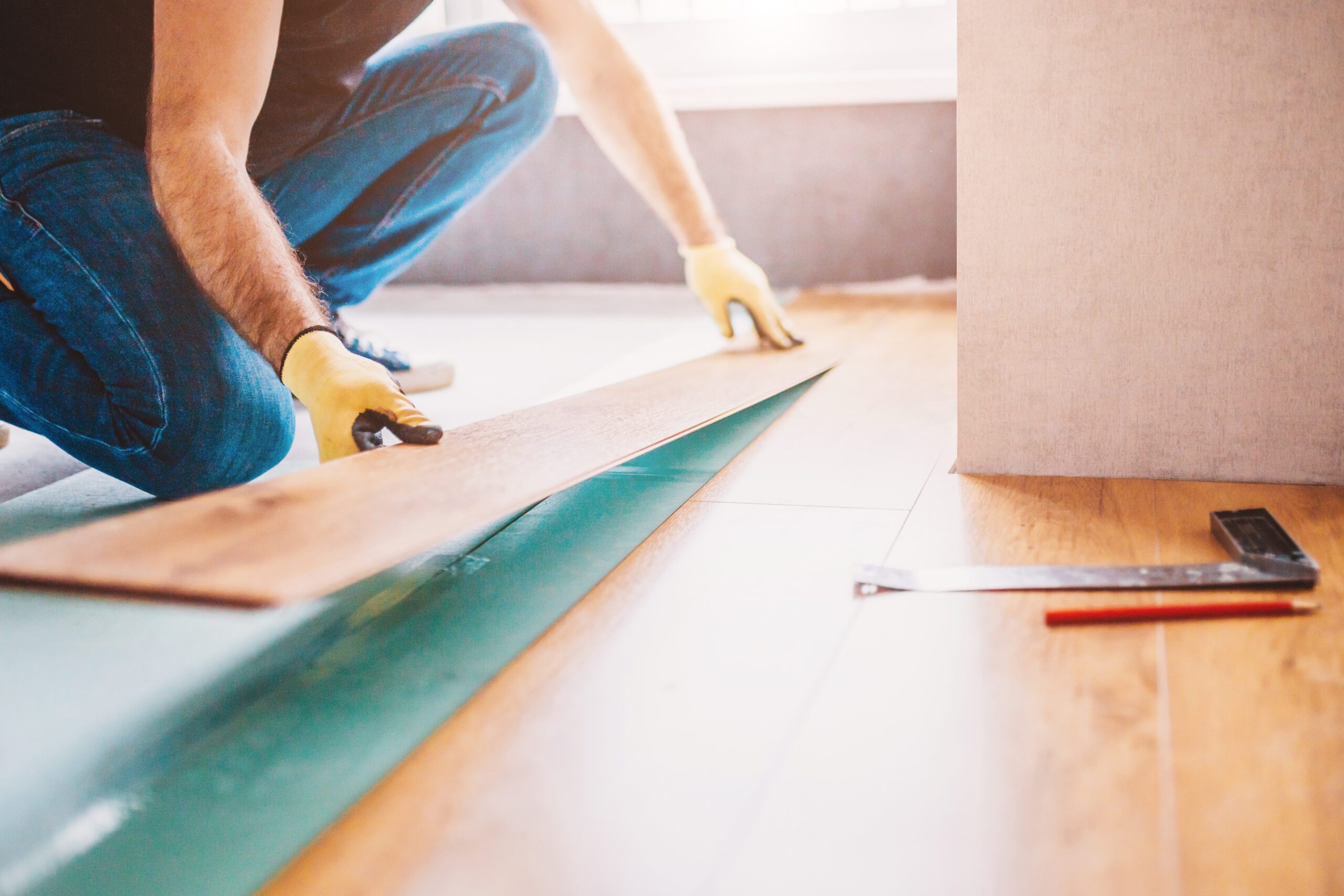 Electrician installing lighting fixtures during a professional home remodel.